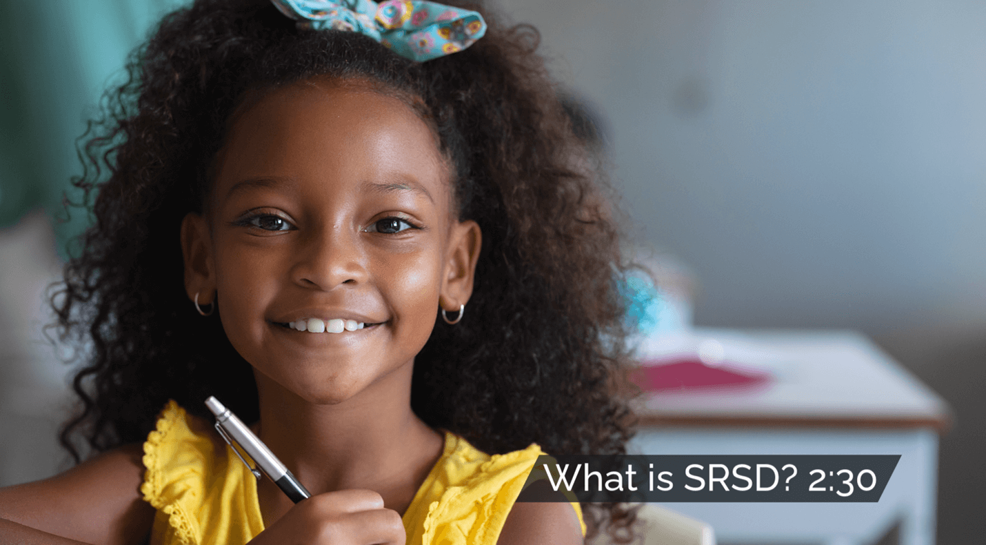 Smiling elementary student holding a pen, with the text 'What is SRSD?' displayed beside her.