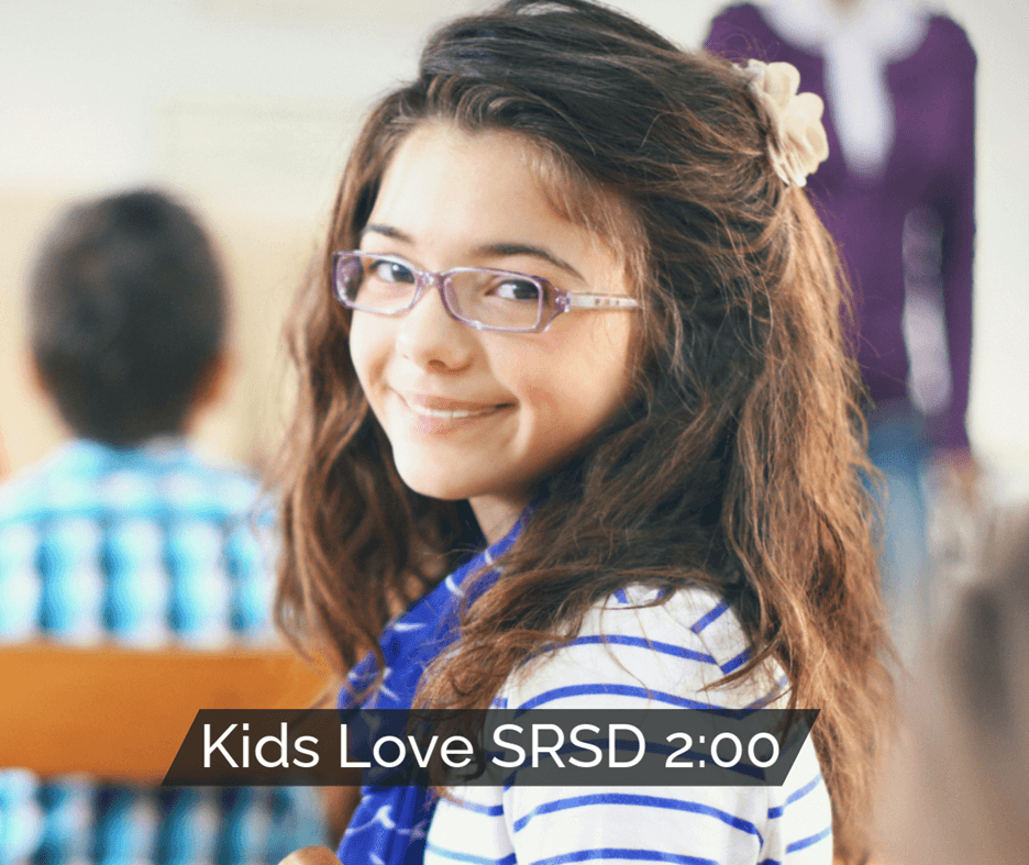 Smiling student in a classroom with the text 'Kids LOVE SRSD!' displayed beside her.