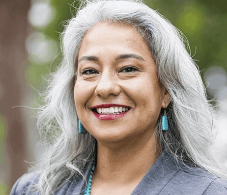 Smiling educator with silver hair